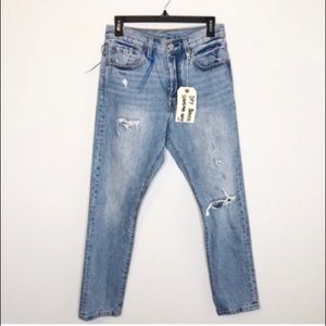 Reformation Levi 501 distressed jeans